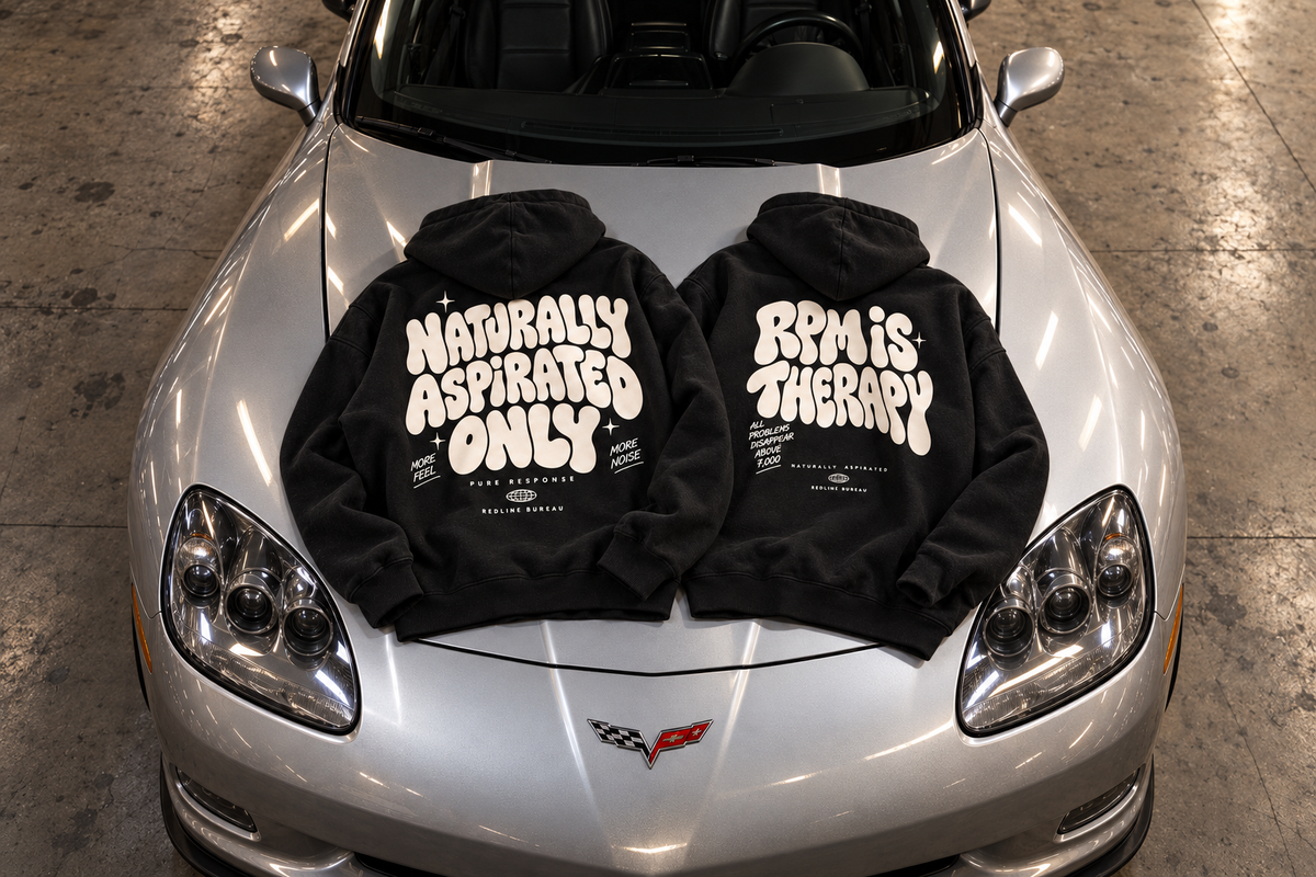Back designs of Naturally Aspirated Only and RPM Is Therapy hoodies displayed on a silver Corvette
